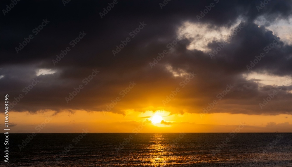 Obraz premium A big sun rises under the dark sky