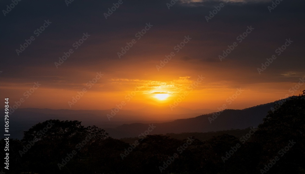 Obraz premium A big sun rises under the dark sky