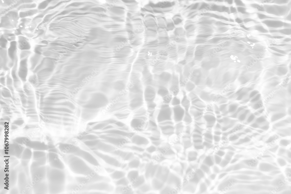 Obraz premium White water with ripples on the surface. Defocus blurred transparent white colored clear calm water surface texture with splashes and bubbles. Water waves with shining pattern texture background.