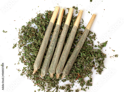 Pre-Roll marijuana joint with cannabis buds in a clear glass jar on the white background