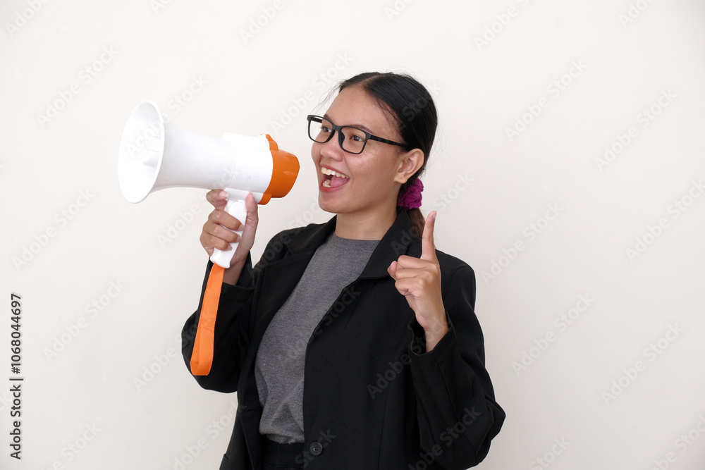 Asian sales woman smilingly speaking on megaphone to announce holiday sale, to call customers Asian sales woman smilingly speaking on megaphone to announce holiday sale, to call customers
