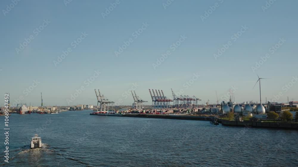 Scenic view of Hamburg harbor with bustling shipyard activity. Perfect for travel documentaries or promotional city tours. Scenic view of Hamburg harbor with bustling shipyard activity. Perfect for travel documentaries or promotional city tours.