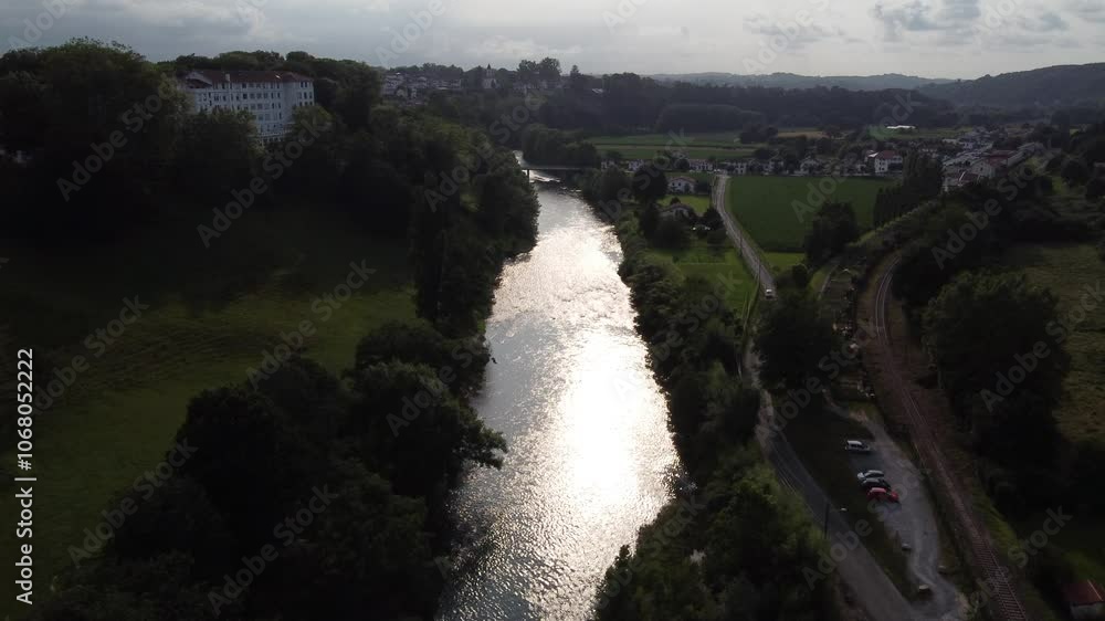 Aerial approach to Nive river and the village of Cambo les Bains, France