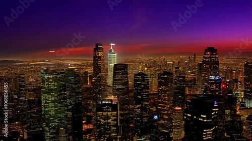 Drone time lapse of Los Angeles skyline at dawn and sunset with golden light