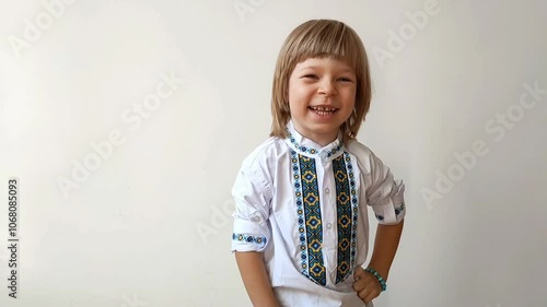 A little boy dressed in Ukrainian traditional clothes, vyshyvanka. Smiling child looking at the camera. Portrait of a little kid smiling child looking at the camera. Children's smile. Close-up face