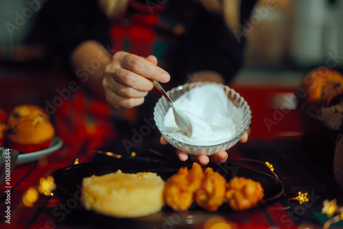 Person Poring Sour Cream Over the Cabbage Rolls. Modern plate with traditional Christmas dish
 photo