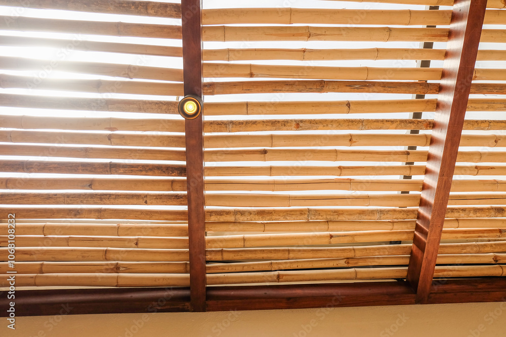 Bamboo pattern to prevent sun for Mediterranean shade,Bamboo mats on a roof,The walls are made of bamboo with sunlight,front view,copy space. Bamboo pattern to prevent sun for Mediterranean shade,Bamboo mats on a roof,The walls are made of bamboo with sunlight,front view,copy space.
