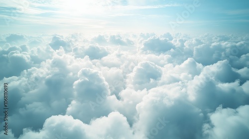 Aerial View Capturing Fluffy White Clouds Bathed in Soft Light, Showcasing a Dreamy Ocean of Clouds From Above During Clear Weather