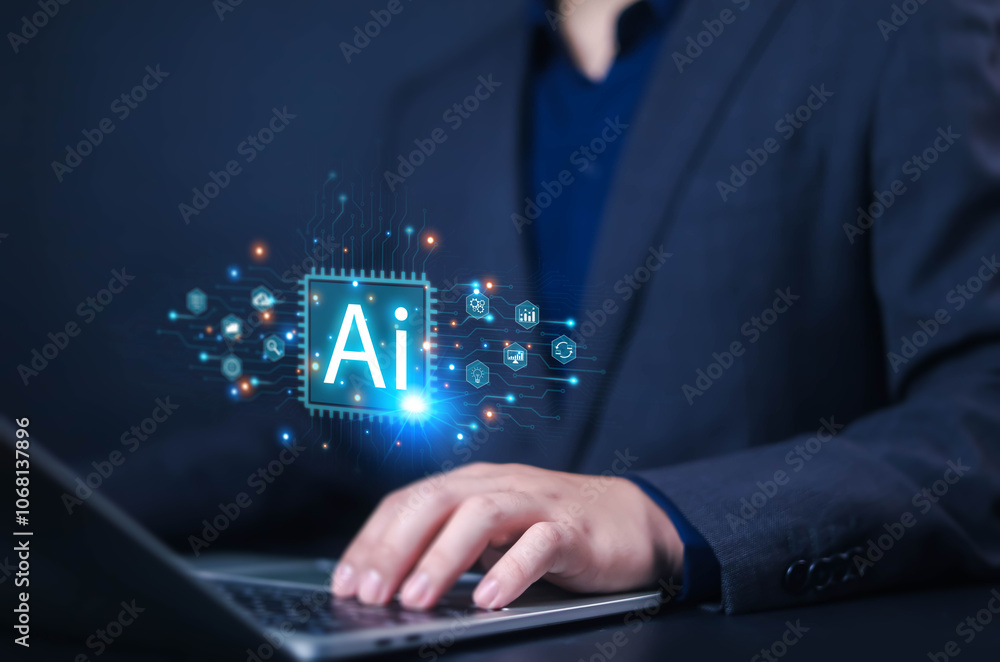 Businessman using laptops with technology AI, AI icon displayed on businessman's screen, Ai technology, Artificial Intelligence helps laptop or smartphone users work or search better. Businessman using laptops with technology AI, AI icon displayed on businessman's screen, Ai technology, Artificial Intelligence helps laptop or smartphone users work or search better.