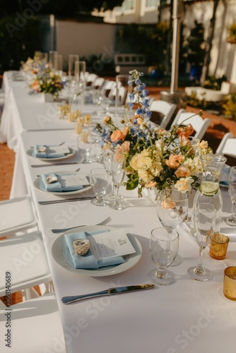 Elegant wedding table setting with flowers and glasses, perfect for a romantic celebration