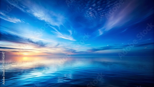 A serene expanse of water reflecting the hues of a fading twilight sky, a mesmerizing tableau of nature's beauty