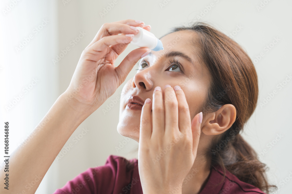 Health care concept, eye problem asian young woman applying, using medical eye drops to treat dry eye and irritation, suffering from irritated eye dry eyes or inflammation, allergy optical symptom. Health care concept, eye problem asian young woman applying, using medical eye drops to treat dry eye and irritation, suffering from irritated eye dry eyes or inflammation, allergy optical symptom.