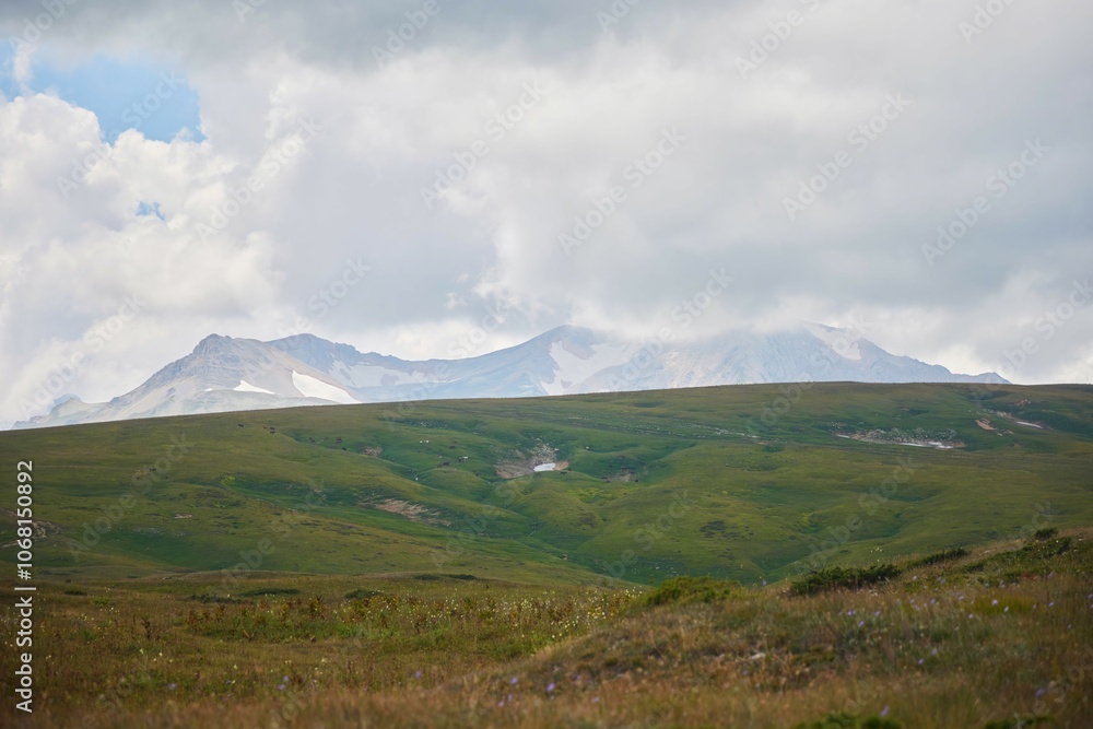 A beautiful landscape with mountains, hills and vegetation. The Caucasus Mountains A beautiful landscape with mountains, hills and vegetation. The Caucasus Mountains