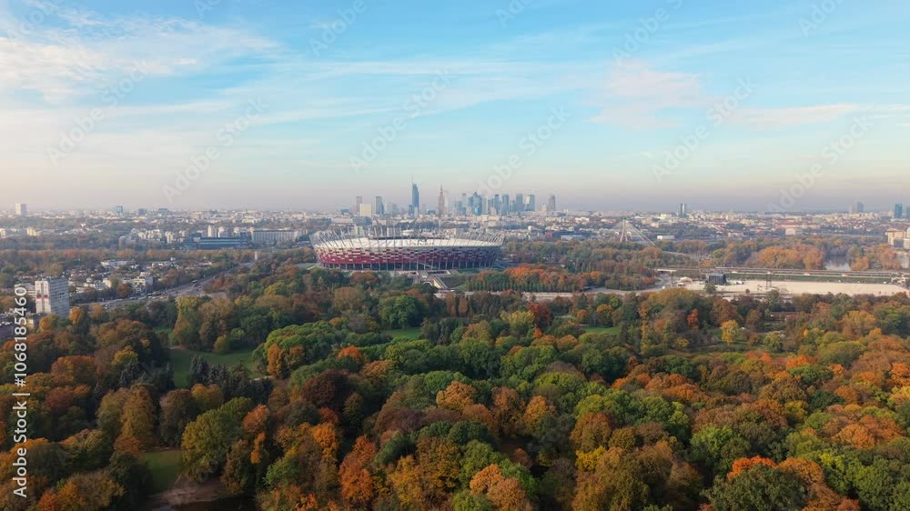 Aerial View of National Football Stadium in Warsaw Poland. Flying Above Colorful Trees on Sunny Misty Autumn Day