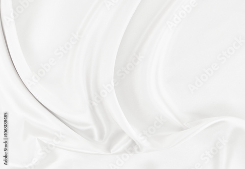 White gray satin texture that is white silver fabric silk background with beautiful soft blur pattern natural.