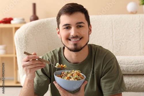 Handsome young man eating t...