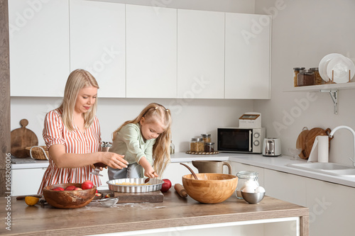 Mother and daughter baking ...