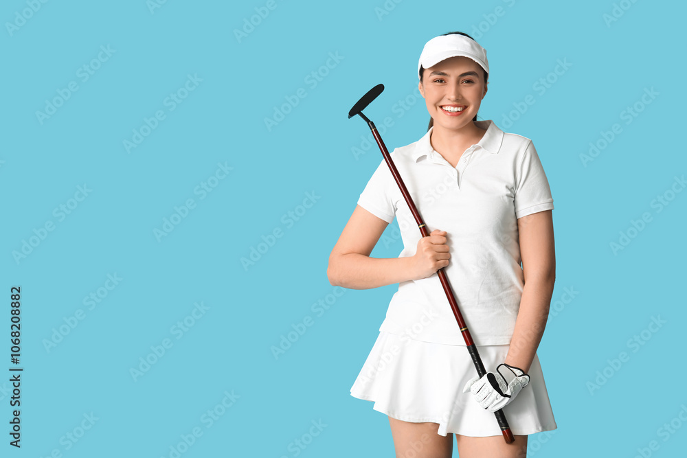 Beautiful female golfer on blue background Beautiful female golfer on blue background