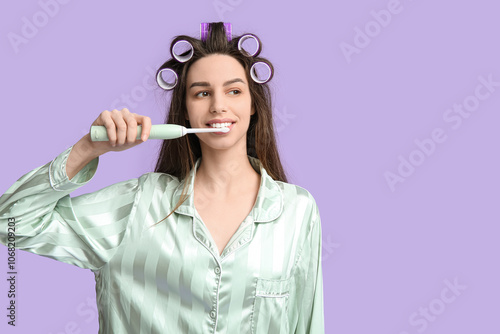 Young woman in pajamas and ...