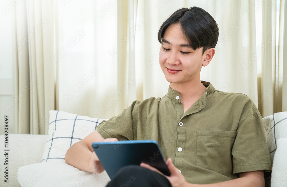 Portrait of asian handsome teenage man live online vlog virtual computer at home sofa living room.Online sme marketing young happy man video call meeting on laptop alone at home. Communicate digital. Portrait of asian handsome teenage man live online vlog virtual computer at home sofa living room.Online sme marketing young happy man video call meeting on laptop alone at home. Communicate digital.