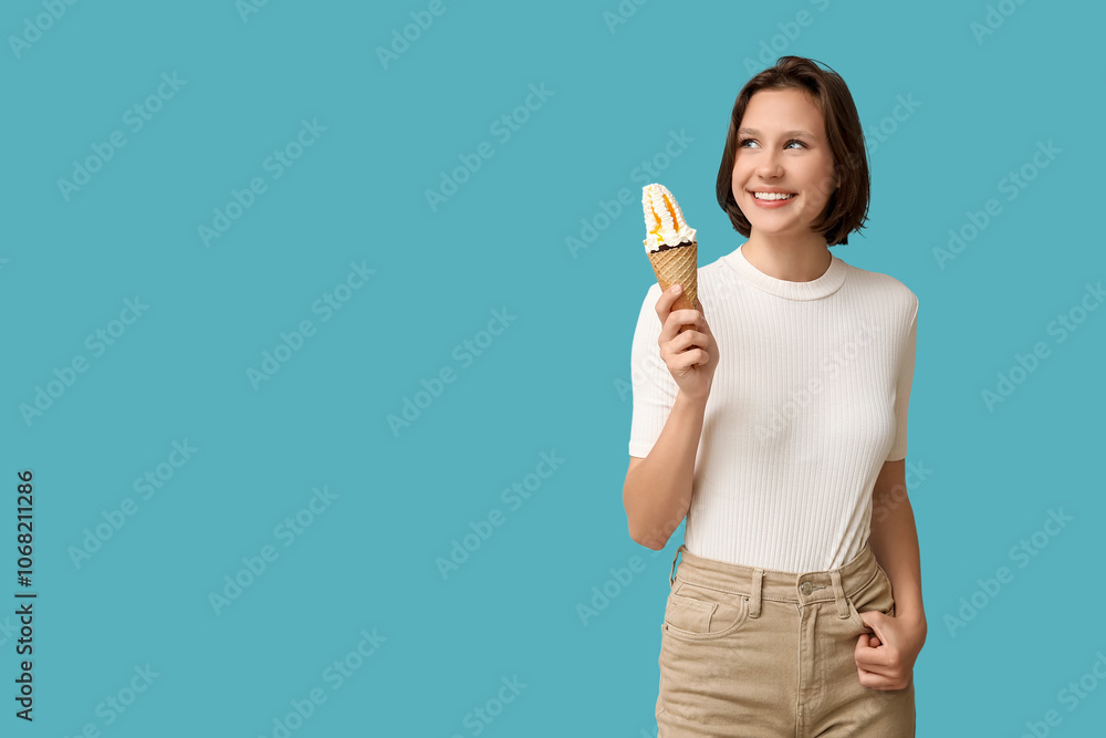 Beautiful young woman with sweet ice-cream in waffle cone on blue background Beautiful young woman with sweet ice-cream in waffle cone on blue background