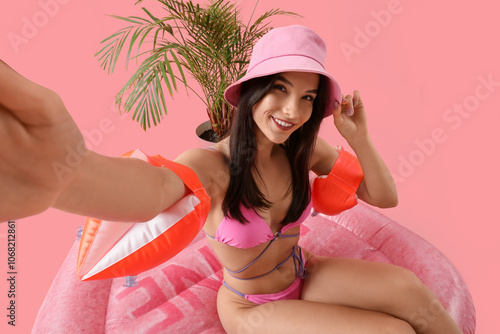 Young pretty woman in hat a...