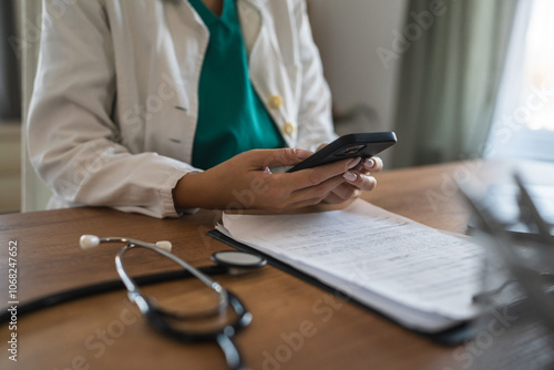 close up of unknown woman doctor take a photo of clipboard at office