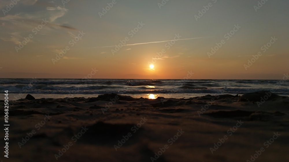 Serene beach sunset with gentle waves. Serene beach sunset with gentle waves.