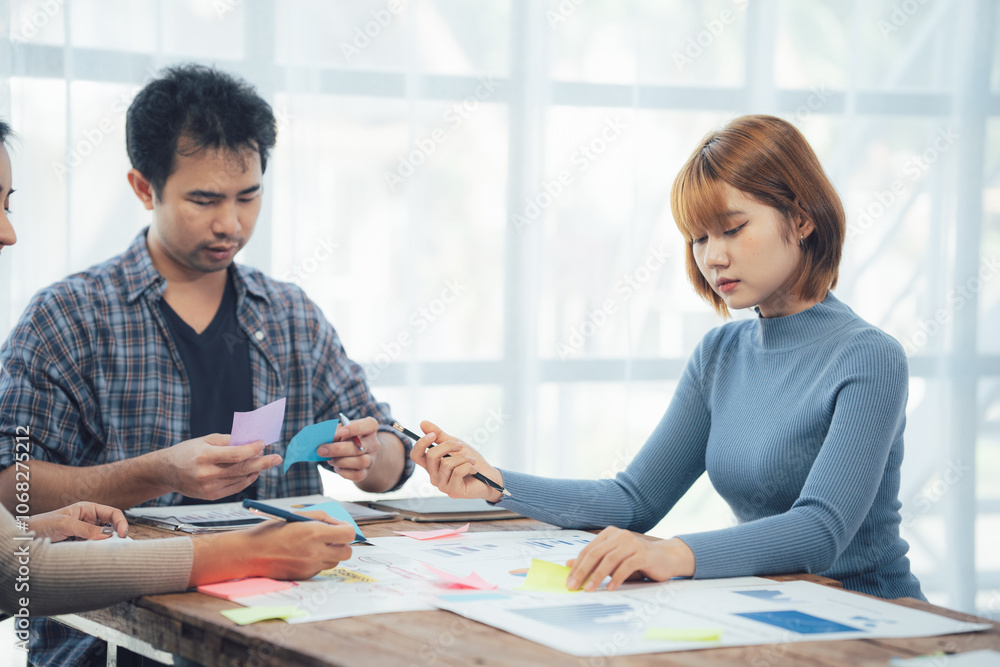 Teamwork Makes the Dream Work: A diverse team collaborates on a project, brainstorming and strategizing with sticky notes. Teamwork Makes the Dream Work: A diverse team collaborates on a project, brainstorming and strategizing with sticky notes.