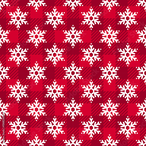 Trendy Christmas seamless pattern. Red Buffalo Plaid background with white winter snowflakes texture. Vector checkered plaid and snowfall print for fashion, fabric, wrapping paper, New Year decor.