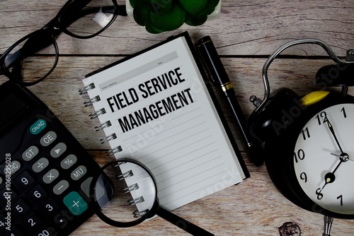 Field Service Management (FSM) text on notepad, Business and Financial concept background photo