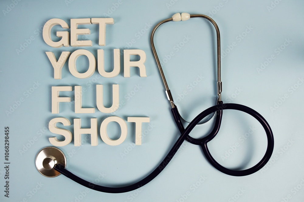 Get Your Flu Shot alphabet letters with stethoscope top view on blue background Get Your Flu Shot alphabet letters with stethoscope top view on blue background