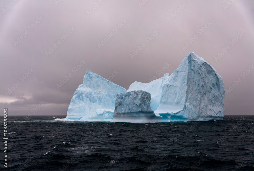 Iceberg drifting off the coast of South Georgia. Antarctica. Iceberg drifting off the coast of South Georgia. Antarctica.