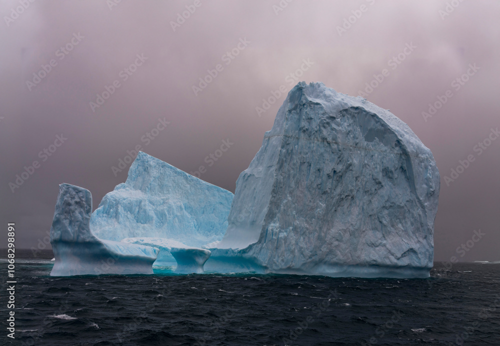 Iceberg drifting off the coast of South Georgia. Antarctica. Iceberg drifting off the coast of South Georgia. Antarctica.