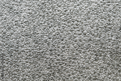 ぼこぼこ、ざらざらの発砲スチロールの表面　テクスチャー背景素材壁紙　粒粒の質感のアップ