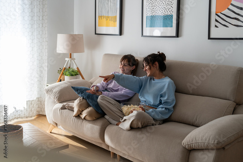 Two girls in a loving couple sharing a tender moment at home