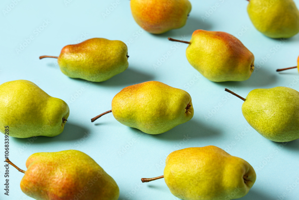 Sweet ripe pears on blue background Sweet ripe pears on blue background