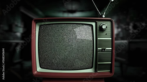 An old TV stands in a creepy room with static on the screen