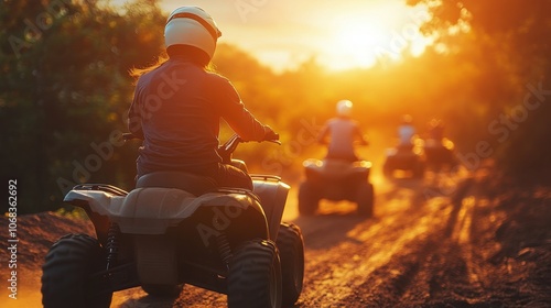 A person on an ATV drives through a forest. This image is perfect for websites or marketing materials promoting outdoor recreation.