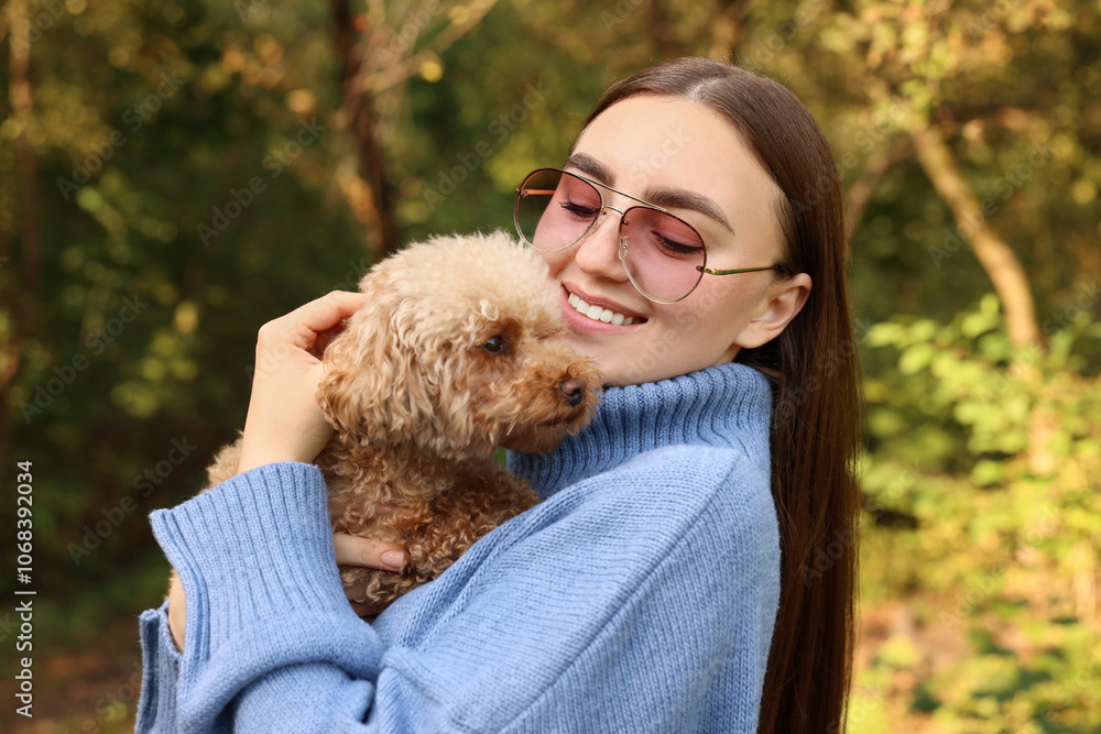 Smiling woman with cute dog in autumn park Smiling woman with cute dog in autumn park