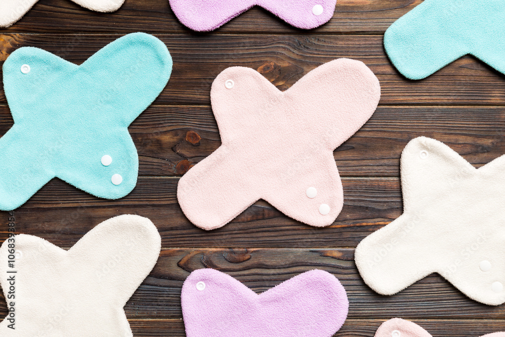 Obraz premium Eco-friendly reusable fabric women's pads. set of colorful bright reusable menstrual pads. zero waste woman periods concept top view with copy space
