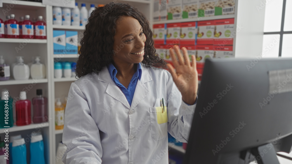 A beautiful young african american woman with curly hair wearing a lab coat, engaging in a videoconference at the pharmacy counter, surrounded by colorful product shelves indoors. A beautiful young african american woman with curly hair wearing a lab coat, engaging in a videoconference at the pharmacy counter, surrounded by colorful product shelves indoors.