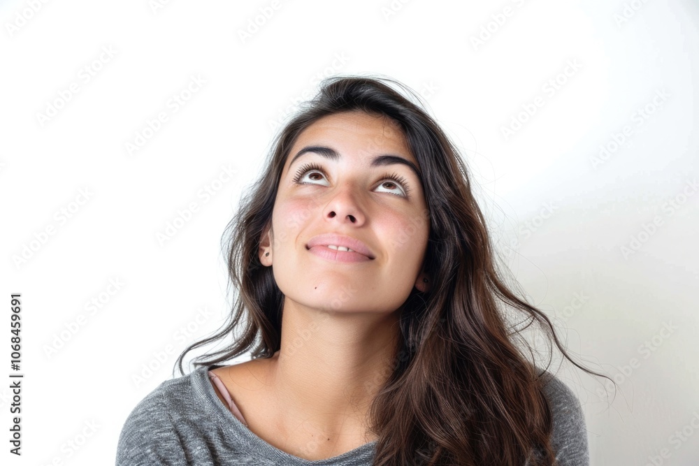 Woman Looking Up. Young Hispanic Female Smiling on White Studio Background Woman Looking Up. Young Hispanic Female Smiling on White Studio Background