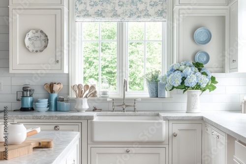 A White Kitchen Sink with B...