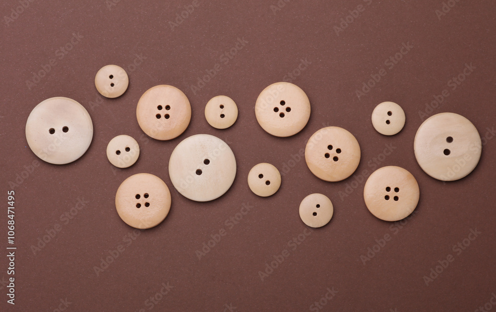 Set of Wooden buttons on a brown background Set of Wooden buttons on a brown background