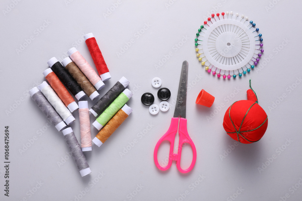 Tailor sewing accessories on gray background. Top view Tailor sewing accessories on gray background. Top view