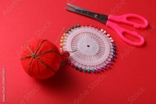 Tailor sewing accessories on red background. photo