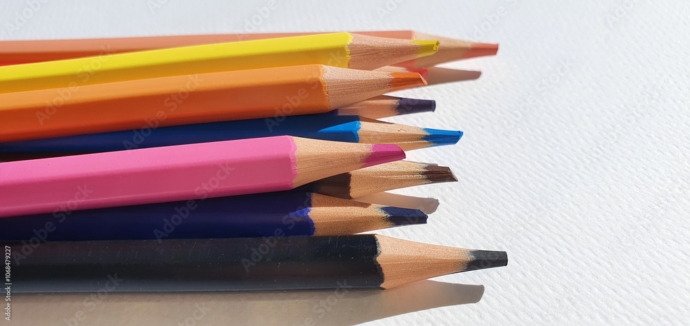 A set of colored pencils isolated on white background. Drawing pencils. A set of colored pencils for school. Bright palette of colors. Pencils in a pencil case. A set of colored pencils isolated on white background. Drawing pencils. A set of colored pencils for school. Bright palette of colors. Pencils in a pencil case.