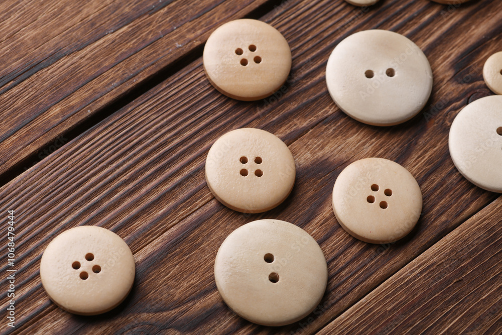 Wooden buttons on a wooden background Wooden buttons on a wooden background