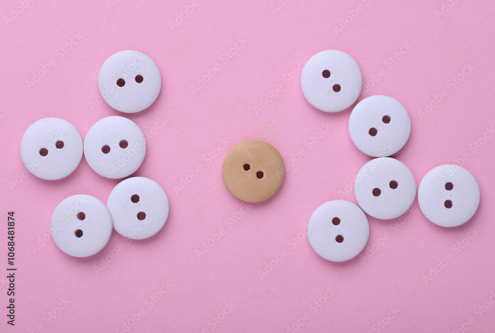 Wooden buttons on a pink background Wooden buttons on a pink background
